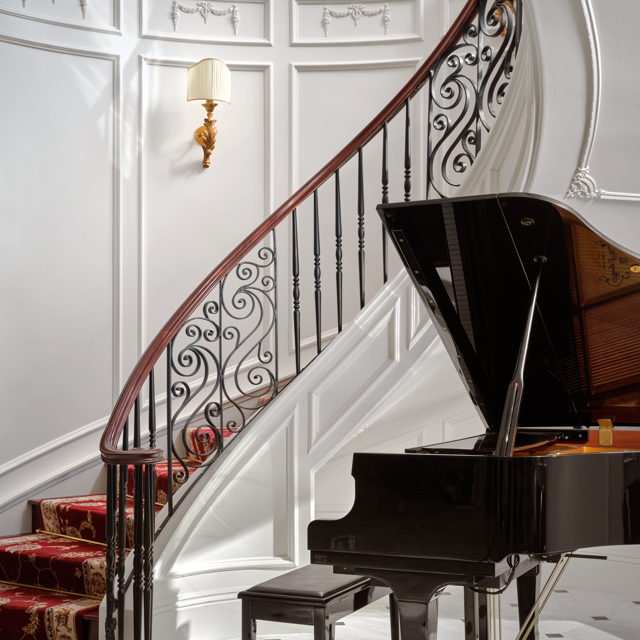 Hospitality photography by Warren Diggles. Stairway and grand piano at HÓZHÓ Scottsdale.