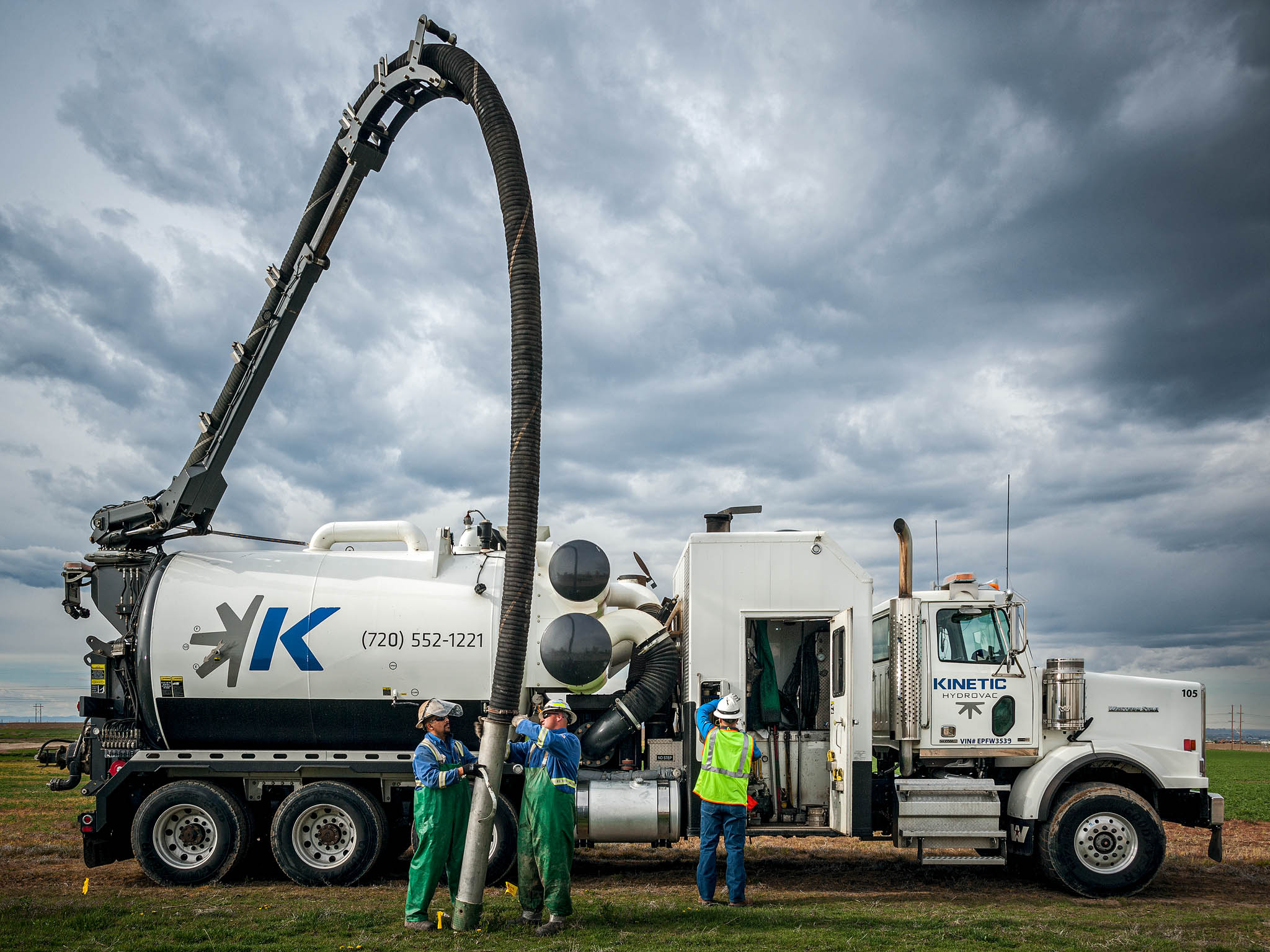 Industrial photography by Warren Diggles. Kinetic hydrovac crew in Greeley, Colorado.