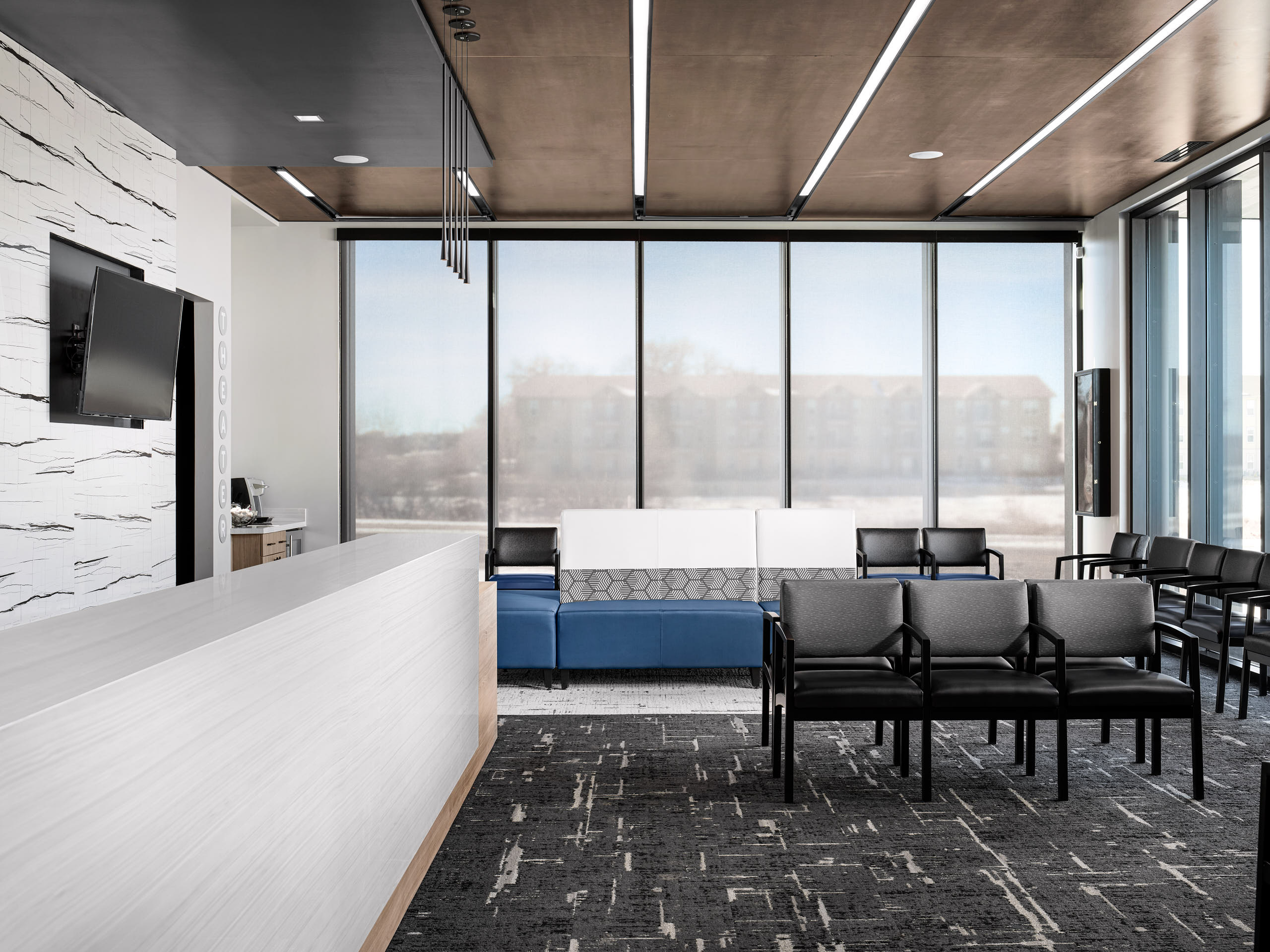 Commercial interior photography by Warren Diggles. 1 point perspective of Richter Orthodontics reception area and waiting room. Project by Design Ergonomics, VFLA Architects, and Elder Construction.