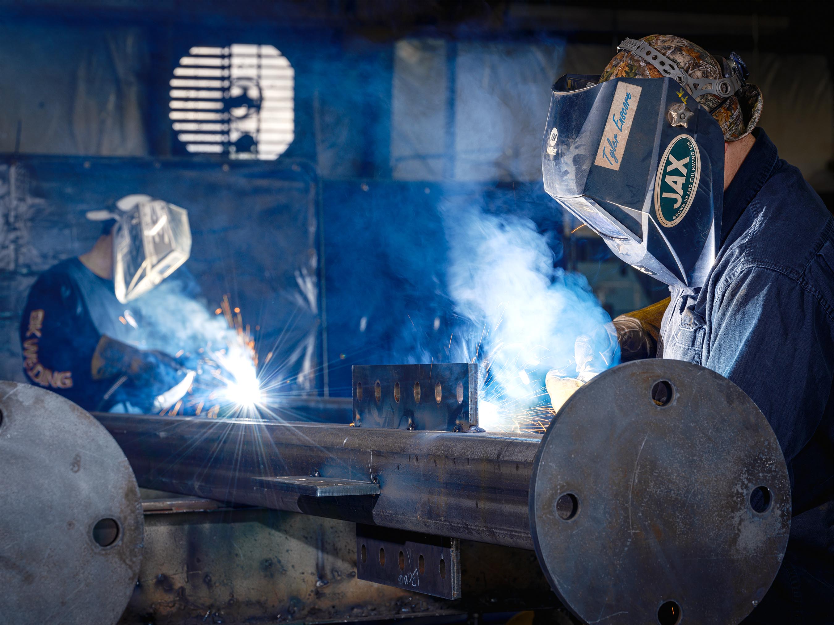 Construction photography by Warren Diggles. Steelworkers fabricating a project at BK Welding shop in Loveland, Colorado.